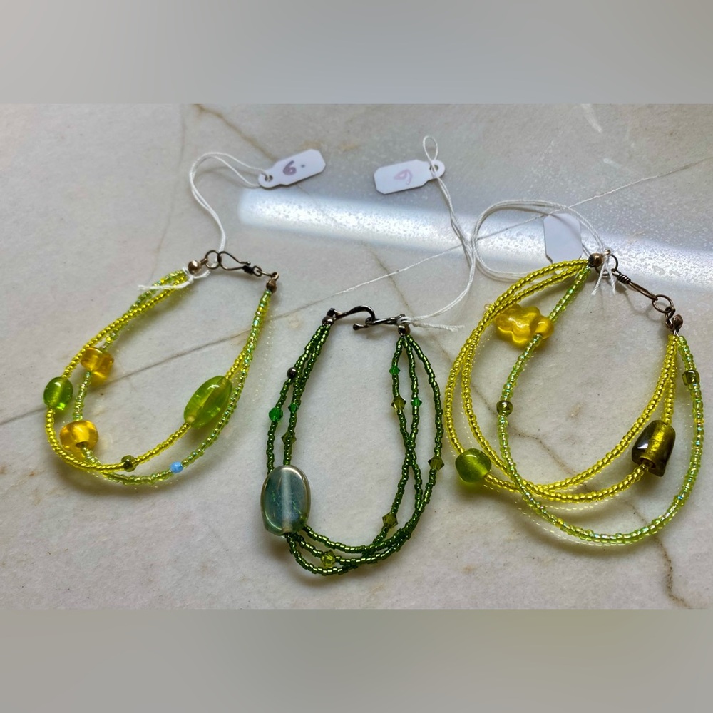 3 multi strand beaded bracelets with clasps in hues of green and yellow